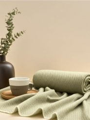 Koc w pepitkę - zielony. Zielone kocyki dla dzieci Sinsay. W wyprzedaży za 27.99 zł.