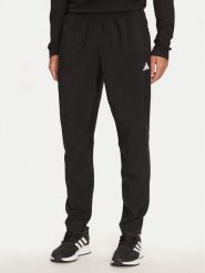 Adidas Spodnie dresowe Own The Run IK5024 Czarny Regular Fit. Czarne spodnie sportowe męskie Adidas, m, bez wzorów, z dresówki, do biegania. Za 199.99 zł.