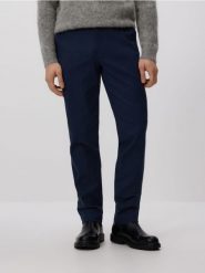 Spodnie chino slim z regulacją w pasie - granatowy. Niebieskie spodnie materiałowe męskie Reserved, bez wzorów, z bawełny. Za 159.99 zł.