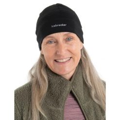 Czapka Zimowa Unisex Icebreaker Mer 200 Oasis Beanie. Czarne czapki i kapelusze męskie Icebreaker, na zimę, bez wzorów, z wełny, sportowe. Za 116.19 zł.