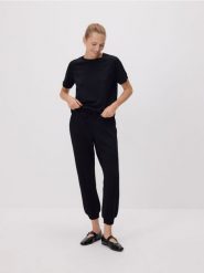 Dresowe spodnie z modalem - czarny. Czarne spodnie dresowe damskie Reserved, l, bez wzorów, z dresówki. Za 119.99 zł.