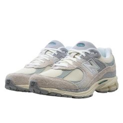 Buty do chodzenia dla dorosłych New Balance 2002R Linen. Brązowe buty sportowe męskie New Balance, z gumy, bez zapięcia, do biegania. W wyprzedaży za 552.10 zł.