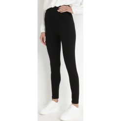 Czarne Legginsy Eryssan. Czarne legginsy damskie Born2be, l, bez wzorów, z bawełny. Za 19.99 zł.