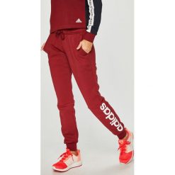 Adidas Performance - Spodnie. Szare spodnie sportowe damskie adidas Performance, z nadrukiem, z bawełny. W wyprzedaży za 139.90 zł.