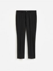 Garniturowe spodnie slim fit - czarny. Czarne eleganckie spodnie męskie Reserved, l, bez wzorów, z tkaniny. Za 169.99 zł.