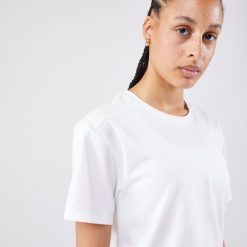 Koszulka tenisowa krótki rękaw damska Artengo Crop Top DRY. Białe koszulki sportowe damskie ARTENGO, xl, bez wzorów, z elastanu, sportowe, bez kołnierzyka. W wyprzedaży za 69.99 zł.
