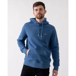 Bluza z kapturem Gant Shield. Niebieskie bluzy męskie GANT, l, z aplikacjami, z bawełny, z kapturem. Za 502.75 zł.