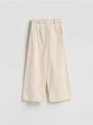 Spodnie we wzór pinstripe - złamana biel. Spodnie materiałowe damskie Reserved, l, bez wzorów, z bawełny. Za 219.99 zł.