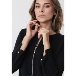 Czarny Kardigan Soleil. Czarne kardigany damskie Born2be, l, bez wzorów. Za 89.99 zł.