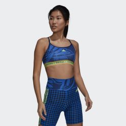 Damski biustonosz typu light support adidas FARM Rio. Niebieskie obuwie sportowe damskie Adidas, bez wzorów, na fitness i siłownię. Za 183.40 zł.