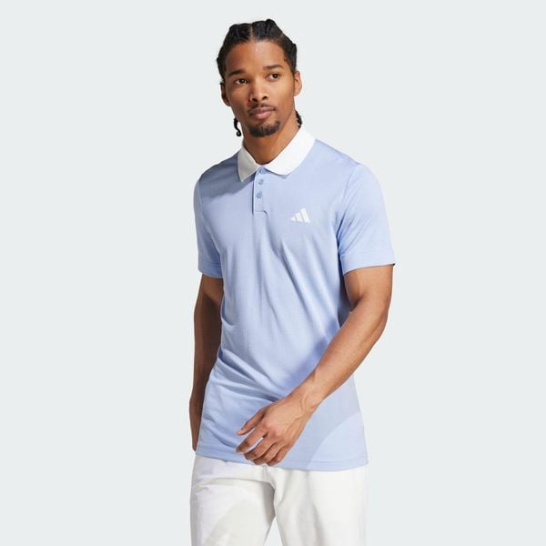 Koszulka Tennis FreeLift Polo. Niebieskie koszulki polo męskie Adidas, l, bez wzorów, z materiału, sportowe, bez ramiączek. Za 276.60 zł.