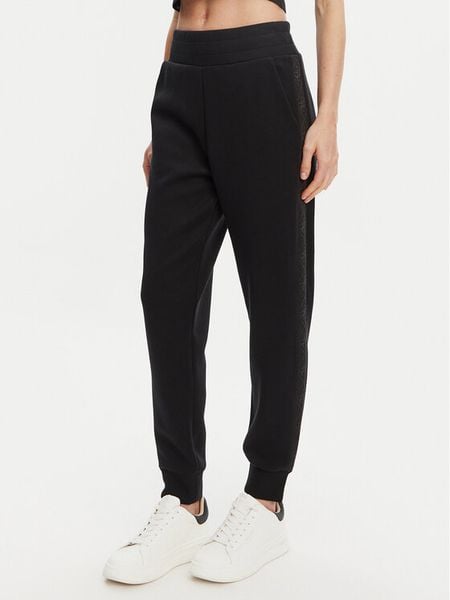 Guess Spodnie dresowe W5YB11 KBYE2 Czarny Regular Fit. Czarne spodnie dresowe damskie Guess, l, z aplikacjami, z dresówki. Za 239.99 zł.