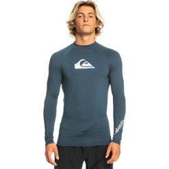 Koszulka do pływania męska Quiksilver All Time. Niebieskie koszulki sportowe męskie Quiksilver, m, bez wzorów, bez kołnierzyka, bez ramiączek, do pływania. W wyprzedaży za 150.35 zł.