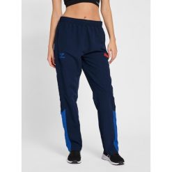 Damskie spodnie dresowe Hummel hmlPRO Grid. Niebieskie spodnie sportowe damskie Hummel, bez wzorów, z dresówki, do biegania. Za 188.50 zł.