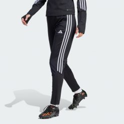 Spodnie Tiro 23 Club Winterized. Czarne spodnie materiałowe damskie Adidas, s, bez wzorów, z materiału, z standardowym stanem. Za 158.35 zł.