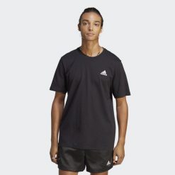 Koszulka sportowa męska adidas Essentials. Czarne koszulki sportowe męskie Adidas, m, bez wzorów, z jersey, bez kołnierzyka, bez ramiączek, do piłki nożnej. W wyprzedaży za 93.40 zł.