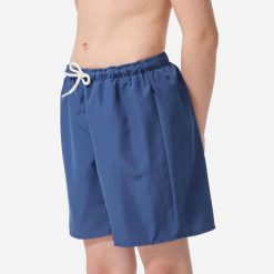 Spodenki surfingowe dla dzieci Olaian 100. Niebieskie szorty dla chłopców OLAIAN, bez wzorów, z materiału, sportowe. Za 19.99 zł.