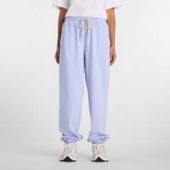 Spodnie damskie New Balance WP41513DYK – fioletowe. Fioletowe spodnie sportowe damskie New Balance, xl, bez wzorów, z bawełny. Za 359.99 zł.