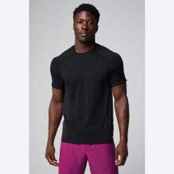 Koszulka Fabletics The Training Day. Niebieskie koszulki sportowe męskie FABLETICS, l, bez wzorów, z materiału, bez kołnierzyka, bez ramiączek, na fitness i siłownię. Za 219.99 zł.