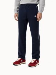 Spodnie do biegania Le Coq Sportif Tri. Niebieskie spodnie sportowe męskie le coq sportif, s, bez wzorów, z dresówki, do biegania. Za 476.00 zł.