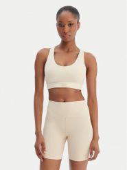 Reebok Biustonosz sportowy Reebok x Ewa Chodakowska Ela RK25615CCW Beżowy. Brązowe koszulki sportowe damskie Reebok, xs, bez wzorów, z syntetyku, bez kołnierzyka, bez ramiączek, na fitness i siłownię. Za 179.99 zł.