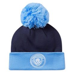 Puma Czapka Mcfc Ess Pom Pom 02561303. Niebieskie czapki i kapelusze damskie Puma, na zimę, bez wzorów. Za 105.60 zł.
