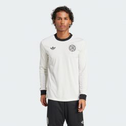 Koszulka Germany Anniversary Long Sleeve. Białe koszulki sportowe męskie Adidas, xs, bez wzorów, z materiału, bez kołnierzyka, bez ramiączek, do piłki nożnej. Za 499.00 zł.