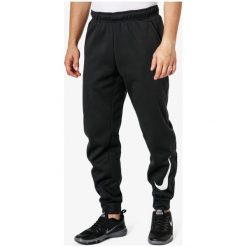 Nike Spodnie Therma Taper Swoosh , czarny, rozmiar L. Czarne spodnie materiałowe męskie Nike, l, bez wzorów, z dresówki. W wyprzedaży za 159.99 zł.
