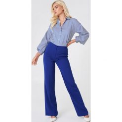 Trendyol Szerokie spodnie garniturowe - Blue. Niebieskie spodnie materiałowe damskie Trendyol, z haftami, z poliesteru. Za 100.95 zł.