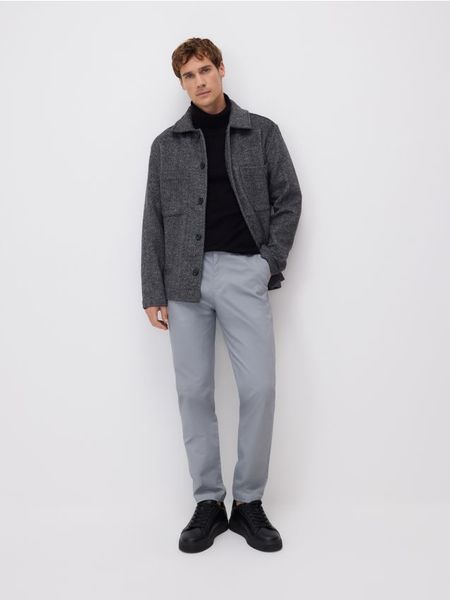 Bawełniane spodnie chino slim - inny. Spodnie materiałowe męskie Reserved, bez wzorów, z bawełny. Za 149.99 zł.