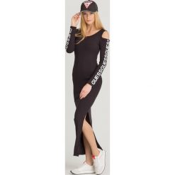 SUKIENKA FIONA GUESS. Czarne sukienki damskie Guess, na imprezę, l, z aplikacjami, z elastanu, bez kołnierzyka, bez ramiączek, maxi, dopasowane. Za 399.00 zł.