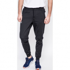 Under Armour - Spodnie Sportstle. Szare spodnie sportowe męskie Under Armour, z dzianiny. W wyprzedaży za 199.90 zł.