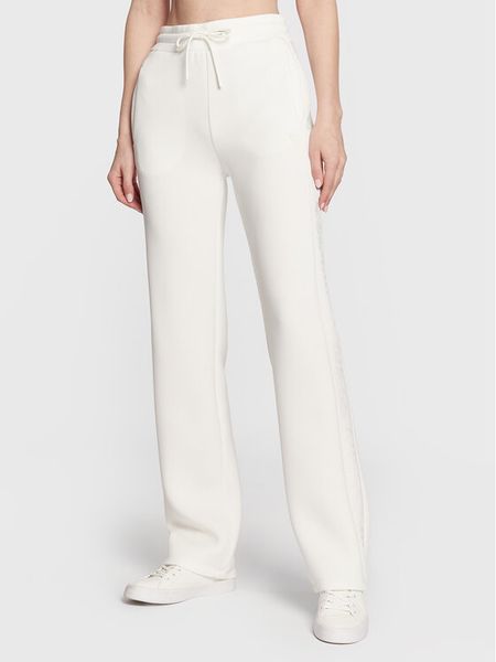 Guess Spodnie dresowe V3RB21 K7UW2 Écru Regular Fit. Białe spodnie dresowe damskie Guess, s, z aplikacjami, z dresówki. Za 238.99 zł.