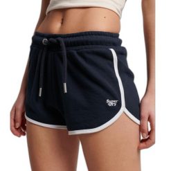 Spodenki turystyczne damskie Superdry Vintage Logo. Niebieskie szorty sportowe damskie Superdry., bez wzorów, z bawełny, sportowe, trekkingowe. W wyprzedaży za 115.00 zł.