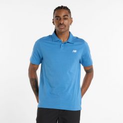 Koszulka męska New Balance MT51504SET – niebieska. Niebieskie koszulki polo męskie New Balance, m, bez wzorów, z materiału, klasyczne, bez ramiączek. Za 99.99 zł.