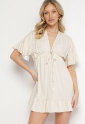 Beżowa Nietoperzowa Sukienka z Wiskozą o Rozkloszowanym Kroju z Falbanką Tullimi. Brązowe sukienki damskie Born2be, na co dzień, uniwersalny, bez wzorów, z wiskozy, eleganckie, bez kołnierzyka, bez ramiączek, mini, kopertowe. Za 64.99 zł.