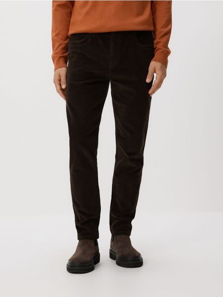 Sztruksowe spodnie slim - ciemnobrązowy. Brązowe spodnie materiałowe męskie Reserved, l, bez wzorów, z bawełny. Za 139.99 zł.