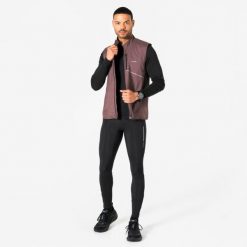Legginsy do biegania męskie Kiprun Run Flow. Czarne legginsy sportowe męskie KIPRUN, l, bez wzorów, z elastanu, długie, do biegania. Za 149.99 zł.