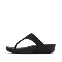 Klapki między palcami damskie FitFlop Lulu Shimmerglitz. Czarne sandały damskie FIT FLOP, bez wzorów, bez obcasa, bez zapięcia. Za 443.50 zł.