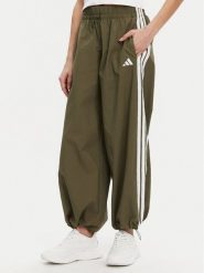 Adidas Spodnie dresowe Essentials 3-Stripes JE1308 Zielony Loose Fit. Zielone spodnie dresowe damskie Adidas, xl, bez wzorów, z dresówki. Za 179.99 zł.