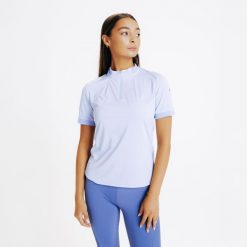 Koszulka jeździecka polo damska z krótkim rękawem Fouganza Heritage. Fioletowe koszulki sportowe damskie FOUGANZA, xl, bez wzorów, z materiału, bez kołnierzyka, bez ramiączek, do jazdy konnej. Za 49.99 zł.