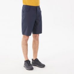 Spodenki turystyczne męskie Quechua NH100. Niebieskie krótkie spodenki sportowe męskie QUECHUA, m, bez wzorów, z bawełny, trekkingowe. Za 49.99 zł.
