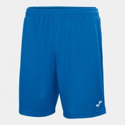 Spodenki do piłki nożnej dla chłopców Joma Nobel. Niebieskie szorty dla chłopców Joma, bez wzorów, z materiału, sportowe. Za 45.00 zł.