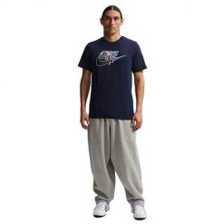 Koszulka sportowa męska Nike Futura. Niebieskie koszulki sportowe męskie Nike, m, bez wzorów, z bawełny, bez kołnierzyka, bez ramiączek, trekkingowe. Za 259.99 zł.