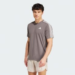 Koszulka Own the Run 3-Stripes. Brązowe koszulki sportowe męskie Adidas, m, bez wzorów, bez kołnierzyka, bez ramiączek, do biegania. Za 199.00 zł.