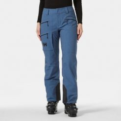 Spodnie narciarskie dla kobiet Helly Hansen Powderqueen. Niebieskie spodnie materiałowe damskie Helly Hansen, bez wzorów. W wyprzedaży za 1,100.50 zł.