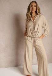 Jasnobeżowy Komplet z Wiskozy w Stylu Oversize Szerokie Spodnie i Luźna Koszula na Guziki Natinne. Brązowe koszule damskie Renee, na wiosnę, bez wzorów, z wiskozy, biznesowe, bez kołnierzyka, bez ramiączek. Za 129.99 zł.