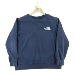 Sweter damski The North Face granatowy. Niebieskie swetry damskie The North Face, l, bez wzorów, z materiału, eleganckie, bez kołnierzyka, bez ramiączek, bez kaptura. Za 106.46 zł.