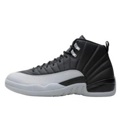 Buty do chodzenia dla dorosłych Air Jordan 12 Retro Black Wolf Grey. Czarne eleganckie półbuty Jordan, ze skóry, eleganckie, bez zapięcia. Za 2,235.36 zł.