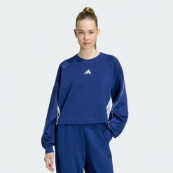Bluza Stadium z zaokrąglonym dekoltem i 3 paskami. Niebieskie bluzy damskie Adidas, m, bez wzorów, z bawełny, bez kaptura. Za 259.00 zł.